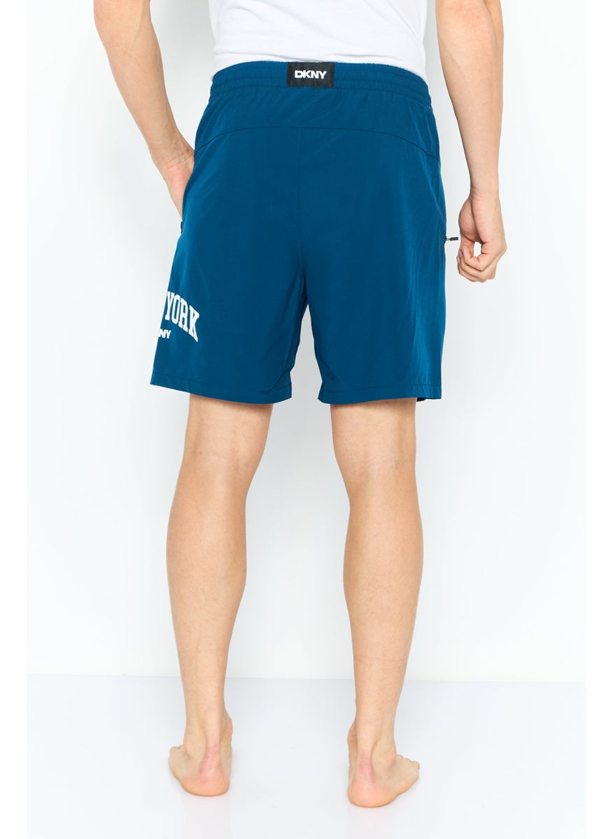 Men Brand Logo Board Shorts, Teal Blue - pzsku/ZBDD3A4B0593299CF82BBZ/45/_/1737642601/c6d71203-1438-44e8-b052-f81712b5707e