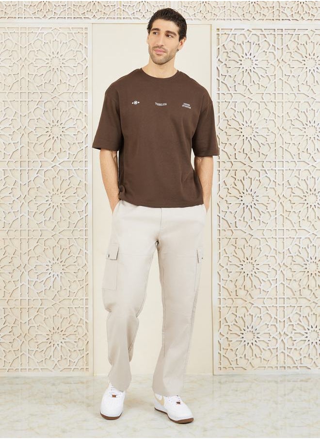 Styli - Front & Back Graphic Print Interlock Oversized T-Shirt - Image 1
