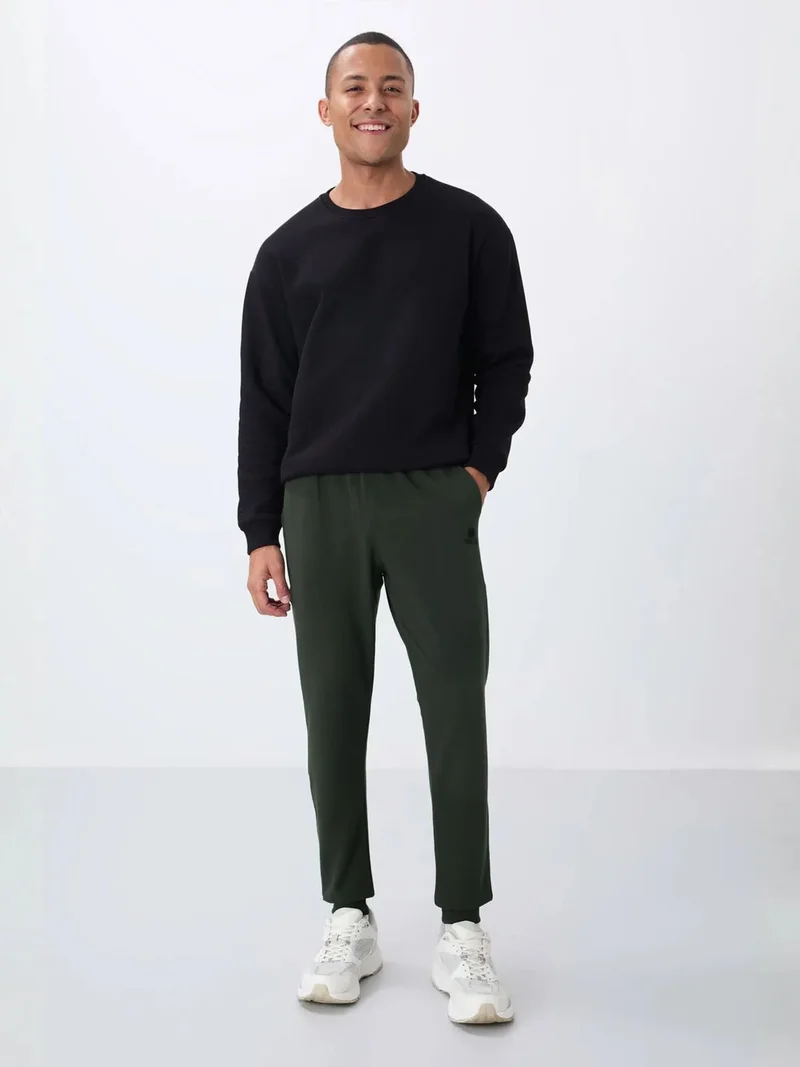 تومي لايف TOMMY Men's Solid Fleece Sweatpants