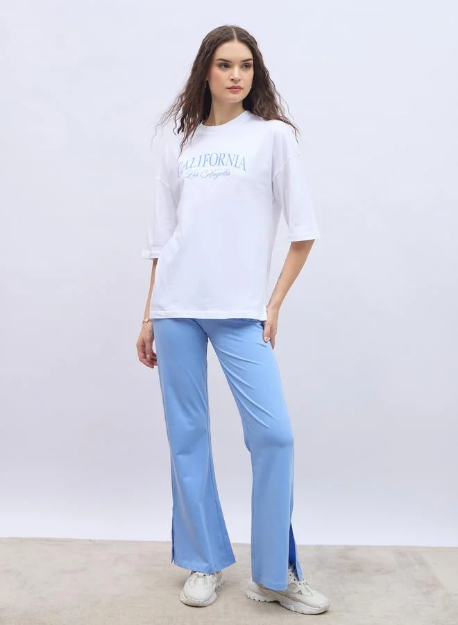 ستايلي Styli Slogan Print Oversized T-Shirt and Flared Leggings Co-Ords