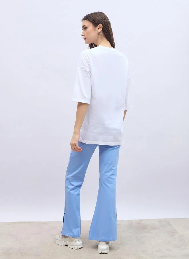 Styli Styli Slogan Print Oversized T-Shirt and Flared Leggings Co-Ords