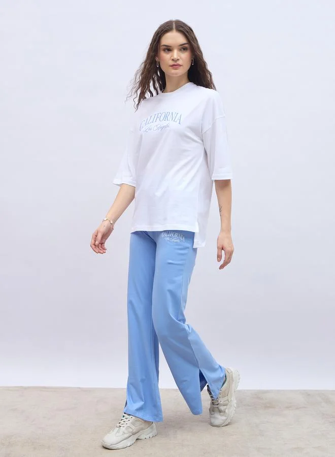 Styli Styli Slogan Print Oversized T-Shirt and Flared Leggings Co-Ords