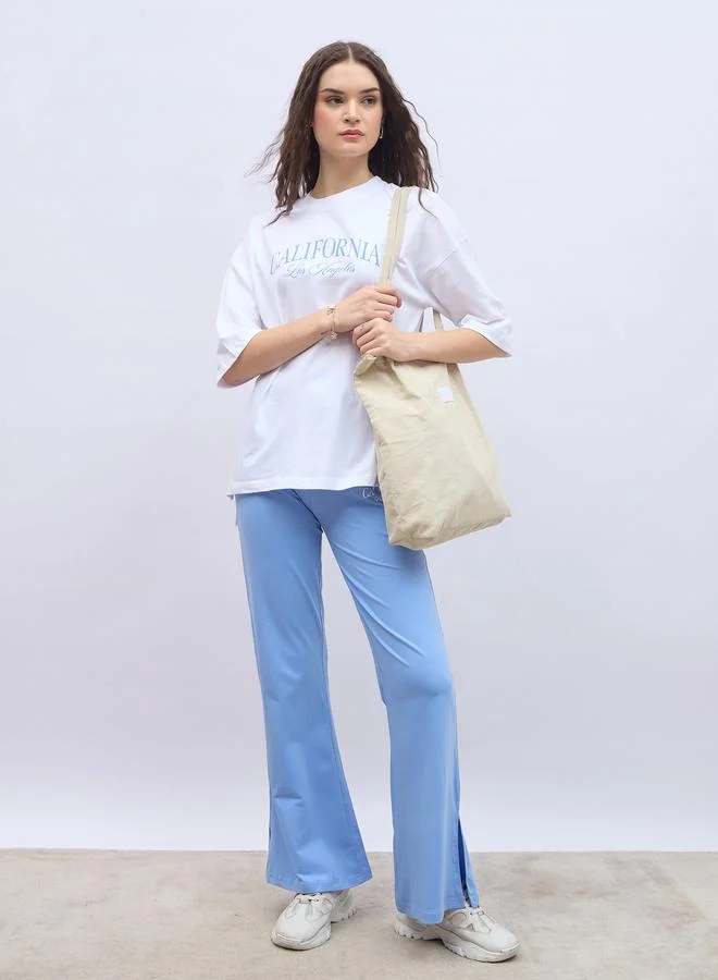 ستايلي Styli Slogan Print Oversized T-Shirt and Flared Leggings Co-Ords