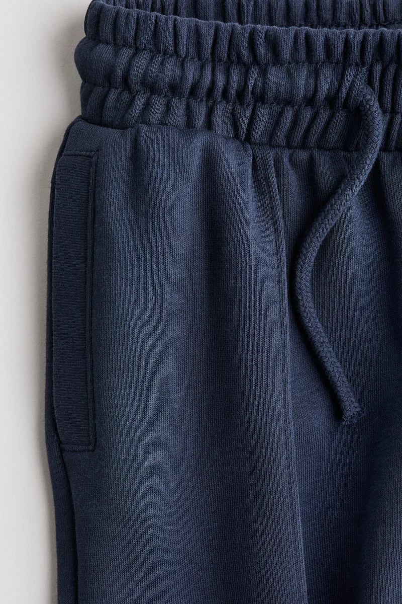 اتش اند ام بنطلون رياضي بكسرات