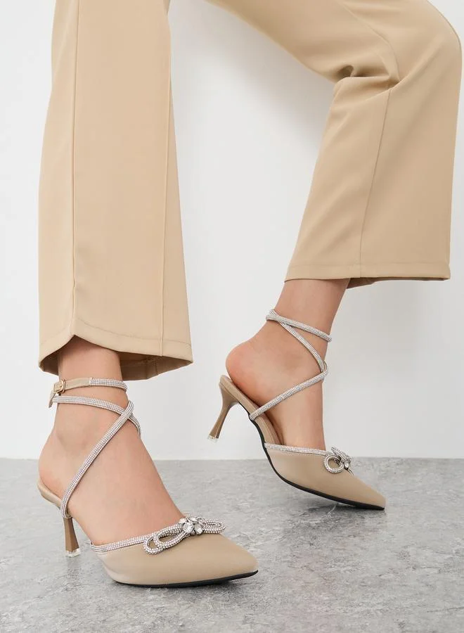 سنيك ايه بيك Sneak-a-Peek Beige Rhinestone Embellished Pointed Toe Ankle Strap Pumps