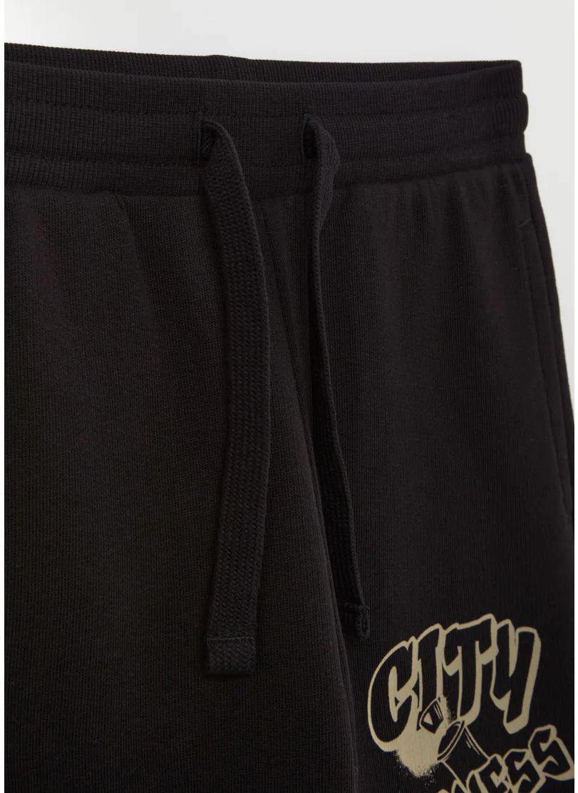 Ovs Fleece joggers with drawstring and print