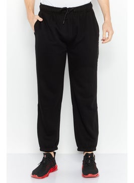DKNY Sport Men Oversized Fit Brand Logo Outdoor Jogger Pants, Black  - Image 1