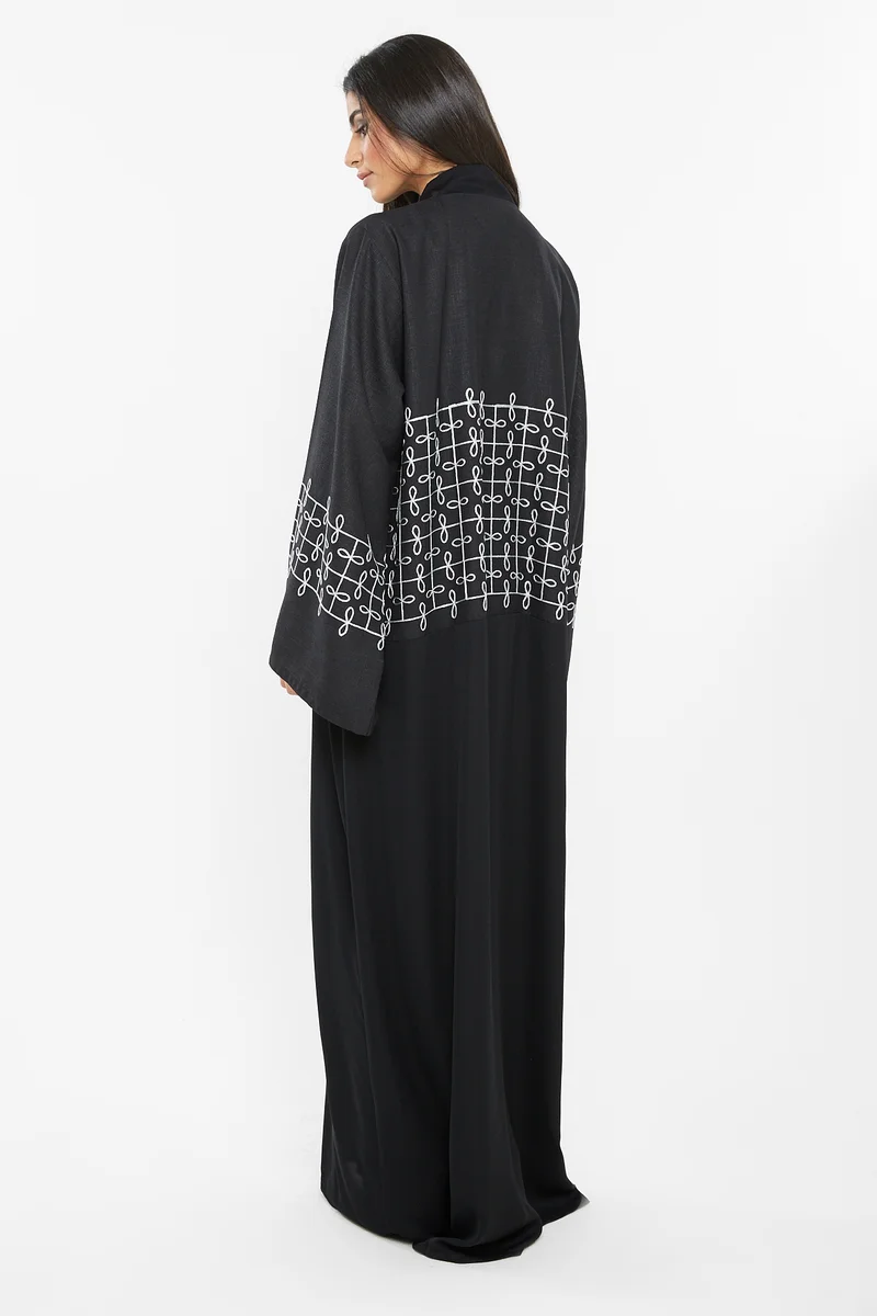 NUKHBAA A trendly yet casual abaya with white knitted embroidery on the top half.-AJ107A