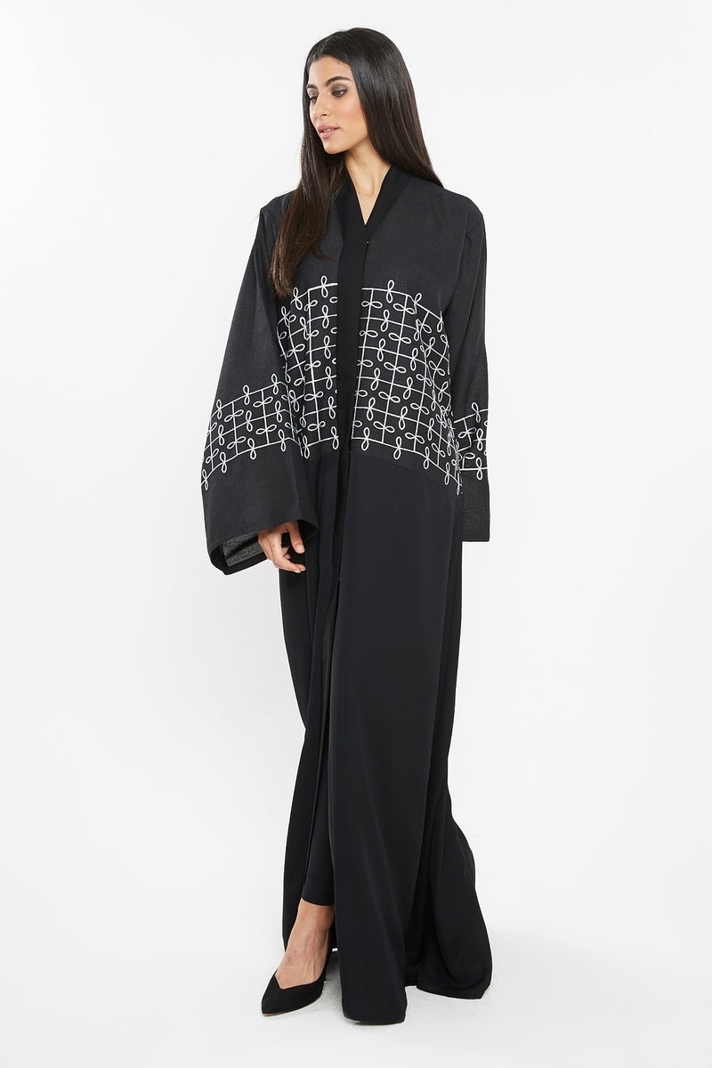 NUKHBAA A trendly yet casual abaya with white knitted embroidery on the top half.-AJ107A - Image 1