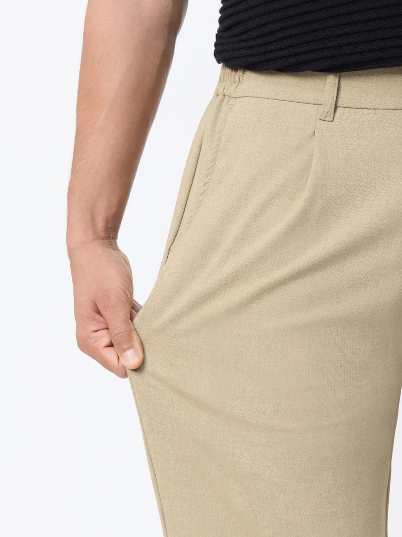 The Souled Store  The Souled Store: Super-Flex Pants Men and Boys Beige Solid Poly-Viscose Blend Straight Fit 4-Way Stretch Wrinkle-Resistant Trousers  | Best Price UAE