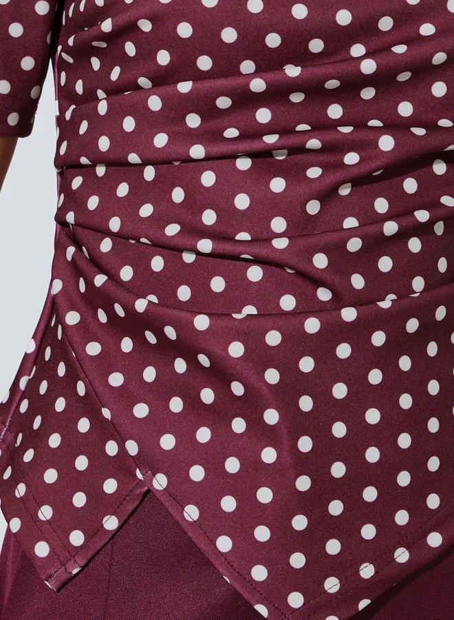 Styli  Burgundy Polka Dot Asymmetric Hem Knit Top for Women | Best Price UAE