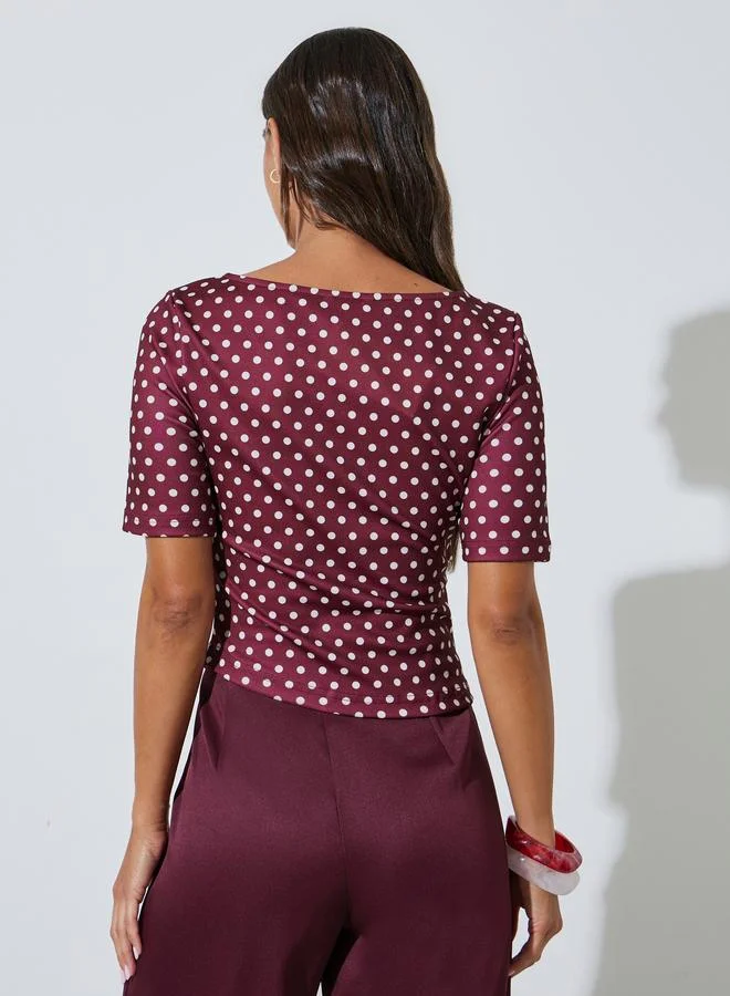 Styli  Burgundy Polka Dot Asymmetric Hem Knit Top for Women | Best Price UAE