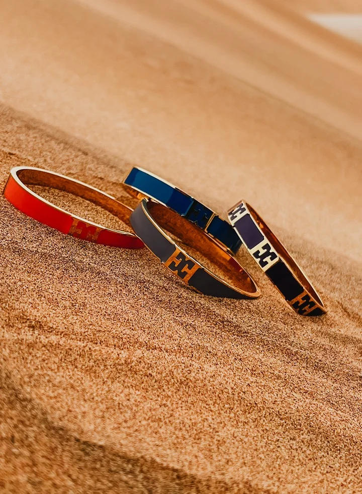 ESCADA Scarlett Gold Plated Bangle with Logo Cutout and Blue Enamel Detail