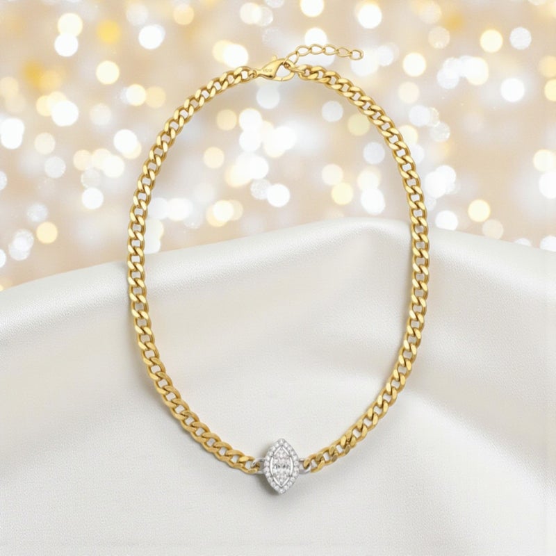 A necklace with a wide gold-plated chain, featuring a small oval silver-tone pendant and smaller sparkling stones. Additional links allow for size adjustment. - Image 4