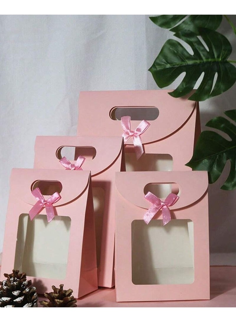 3 different sized pink cardboard bags with a clear window and a pink bow, perfect for gift giving and all occasions. - Image 2