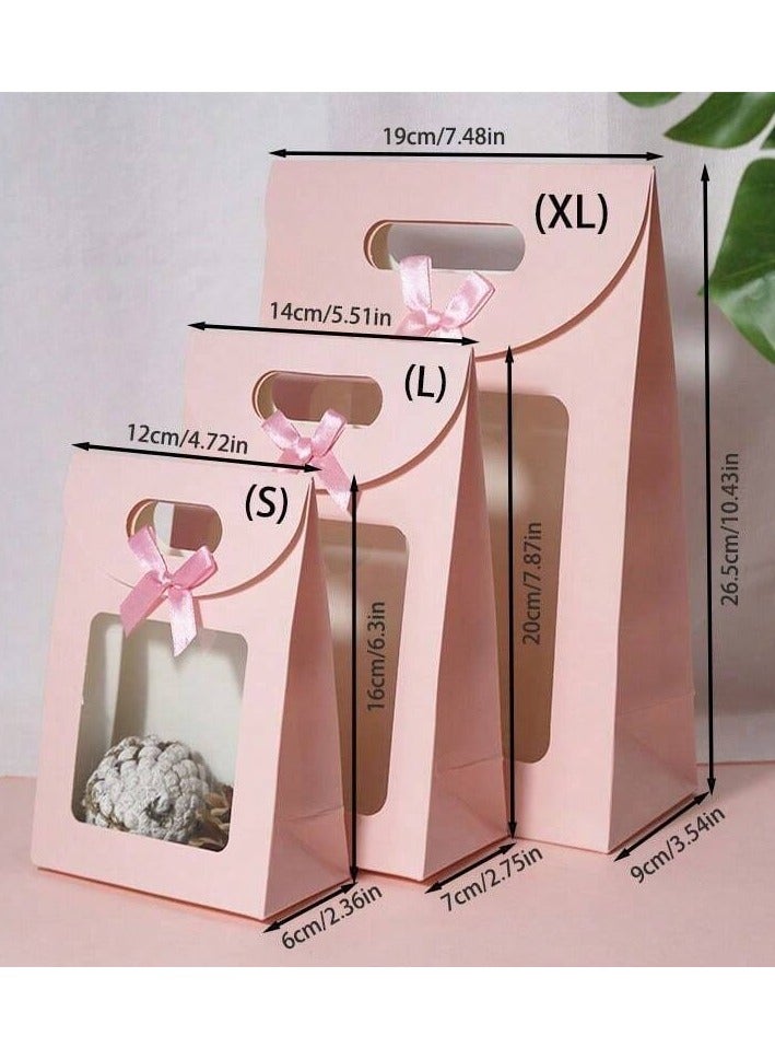 3 different sized pink cardboard bags with a clear window and a pink bow, perfect for gift giving and all occasions. - Image 3