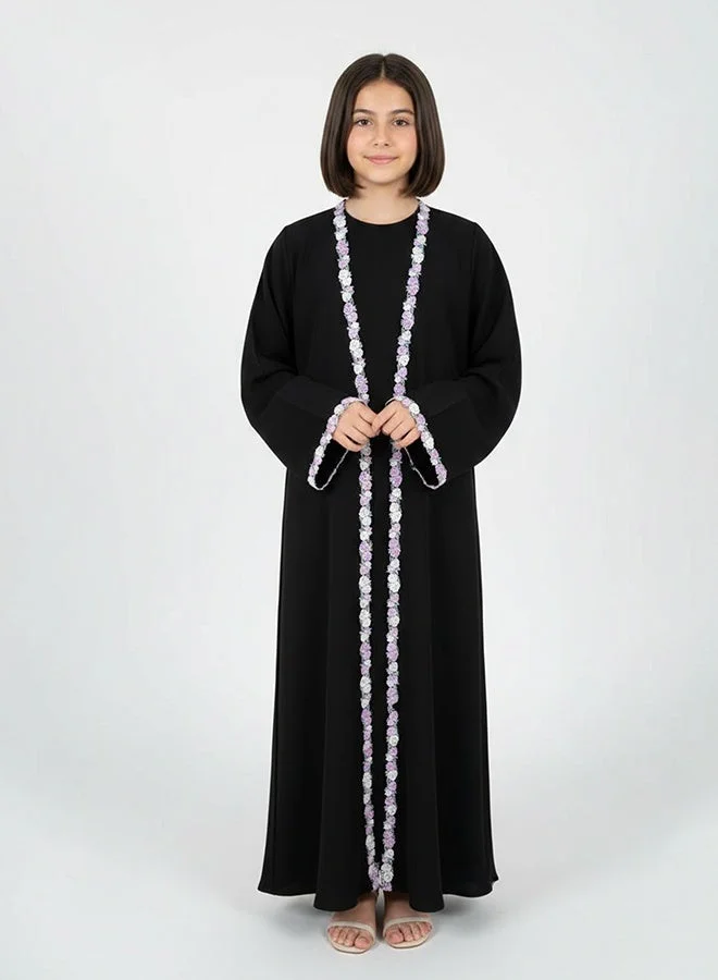 HAWRAA ABAYA Black girls’ abaya adorned with elegant floral trim