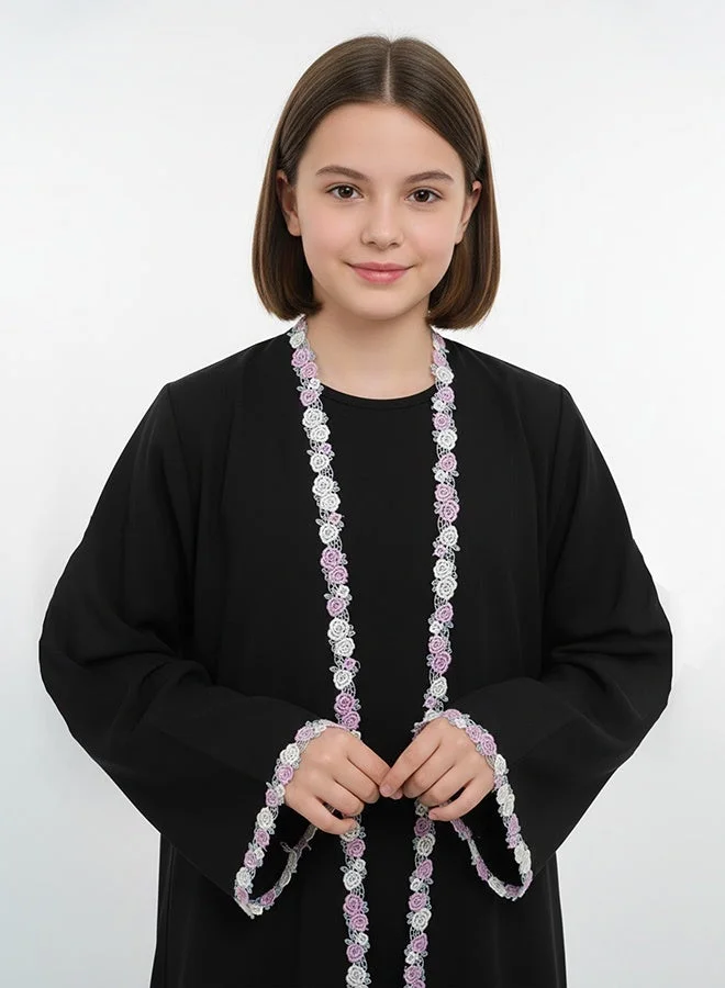 HAWRAA ABAYA Black girls’ abaya adorned with elegant floral trim