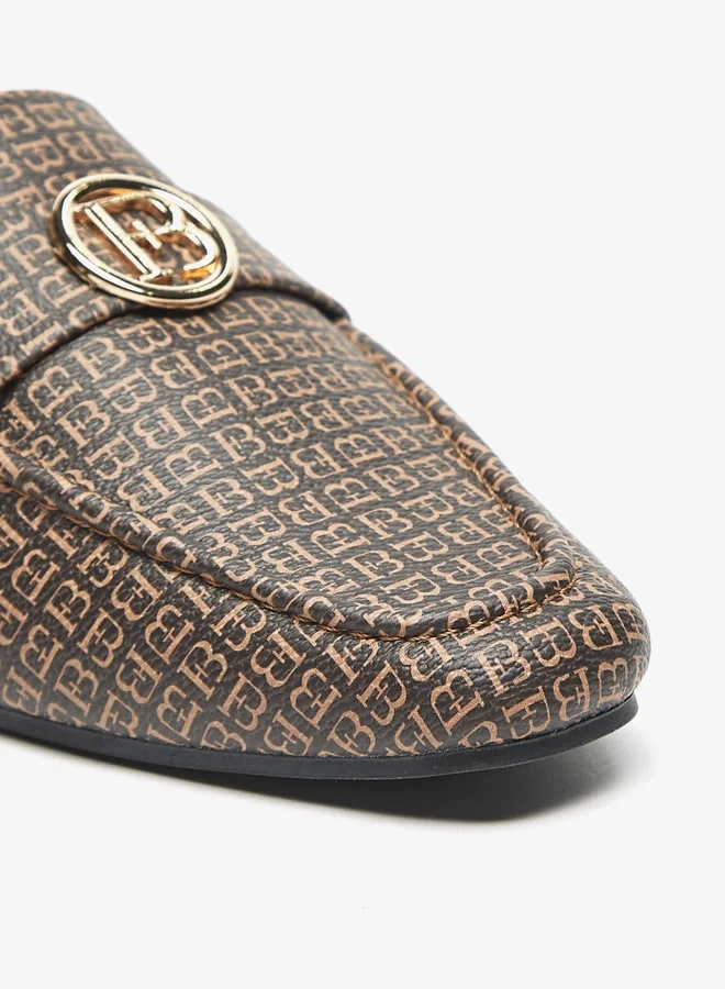 فلورا بيلا من شو إكسبرس All-Over Monogram Print Slip-On Mules with Metal Accent