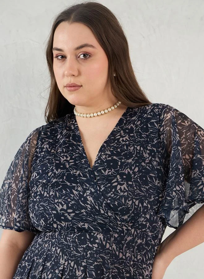 Femmella Plus Size Floral Print Wrap Look A-Line Maxi Dress by Styli