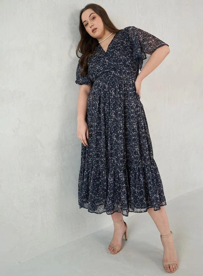 Femmella Plus Size Floral Print Wrap Look A-Line Maxi Dress by Styli