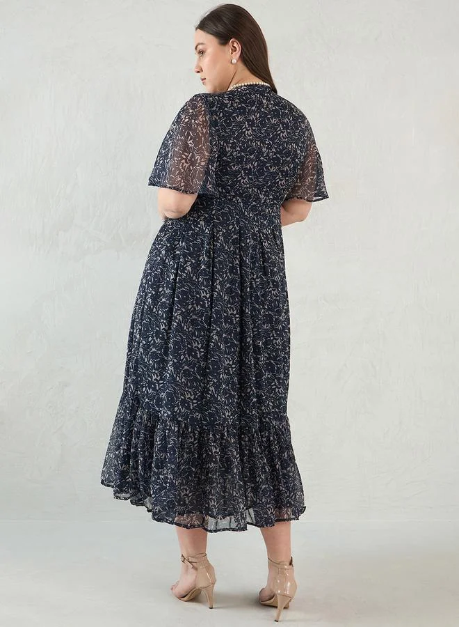 Femmella Plus Size Floral Print Wrap Look A-Line Maxi Dress by Styli