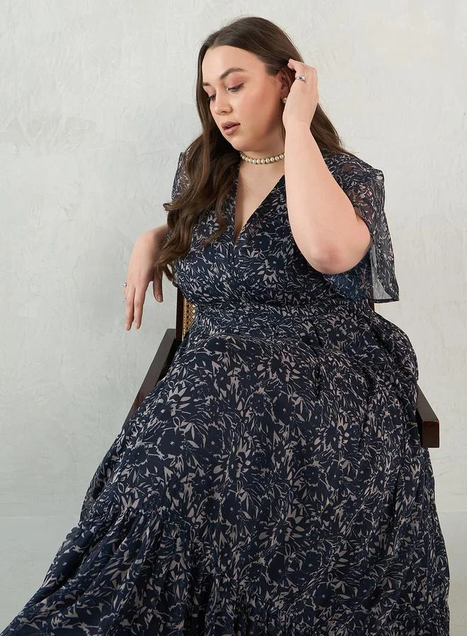 Femmella Plus Size Floral Print Wrap Look A-Line Maxi Dress by Styli