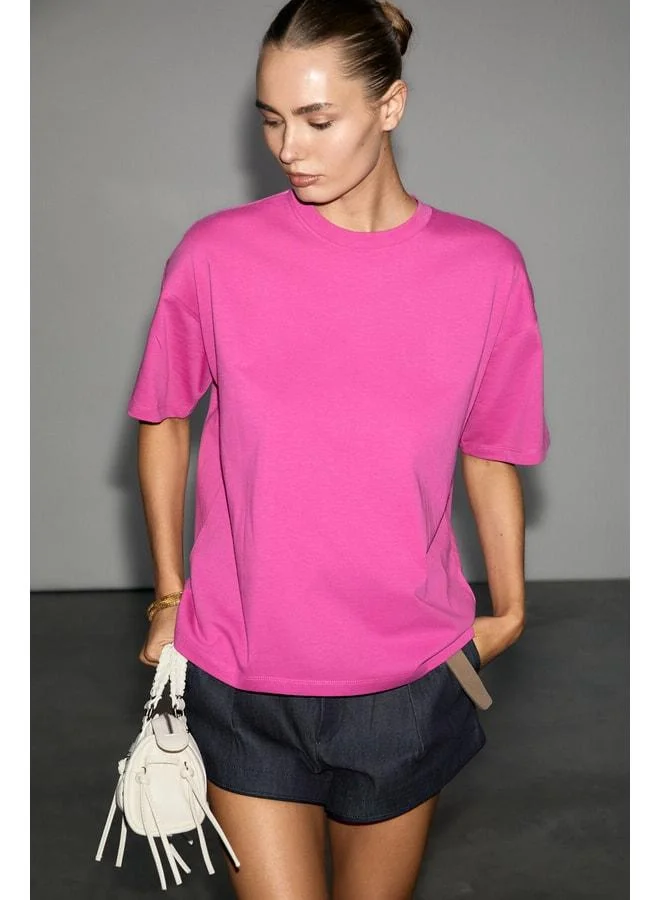 Grimelange LAGERTHA Women's %100 organic cotton thick textured oversized fit round‑collar fuchsia T‑shirt.