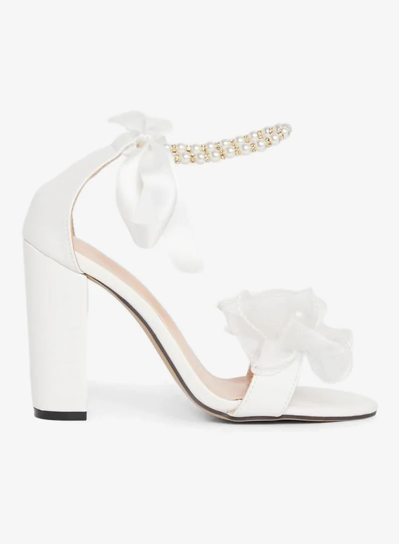 Take Two Floral Faux Pearl Applique Block Heel Sandals by Styli