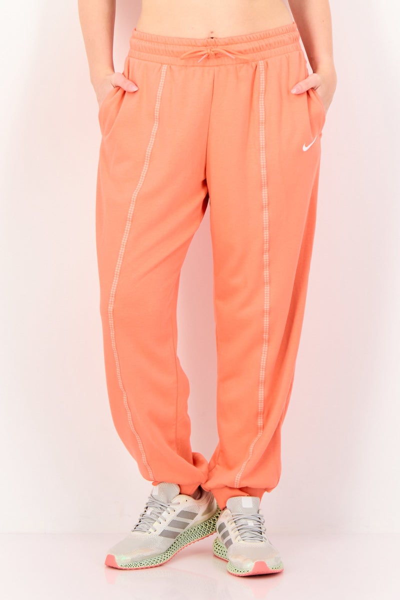 Nike سروال رياضي فضفاض للنساء، برتقالي - Image 1