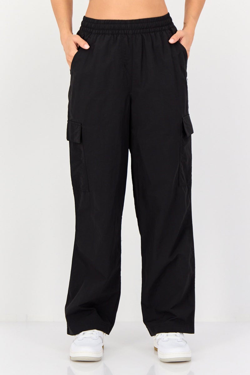 PUMA Women Sportswear Fit Outdoor Track Pants, Black - Image 1