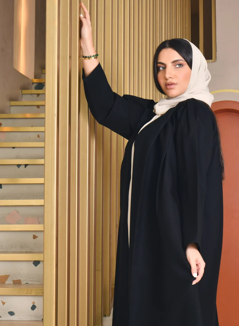 HAWRAA ABAYA Plain black wrap abaya with puffed sleeves decorated with pleats and pleated edges