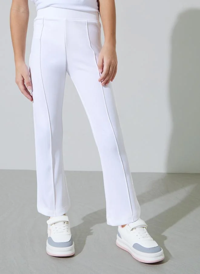ستايلي Girls Off-White Solid Fit and Flared Leggings with Pintuck Detail