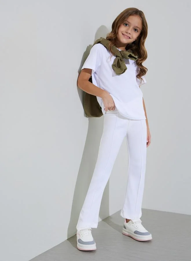 ستايلي Girls Off-White Solid Fit and Flared Leggings with Pintuck Detail