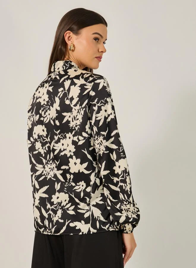 Styli All Over Floral Print Balloon Sleeve Blouse with Tie-Up Neck Detail