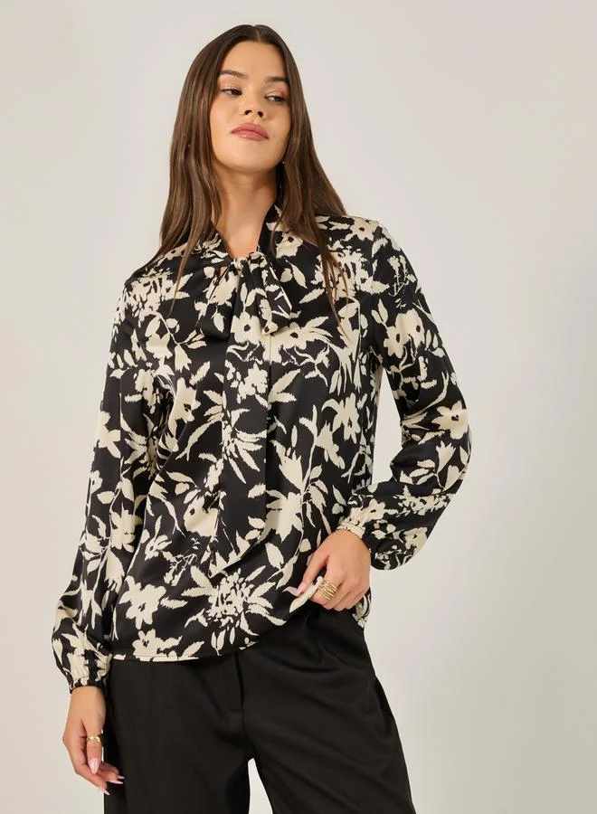 Styli All Over Floral Print Balloon Sleeve Blouse with Tie-Up Neck Detail