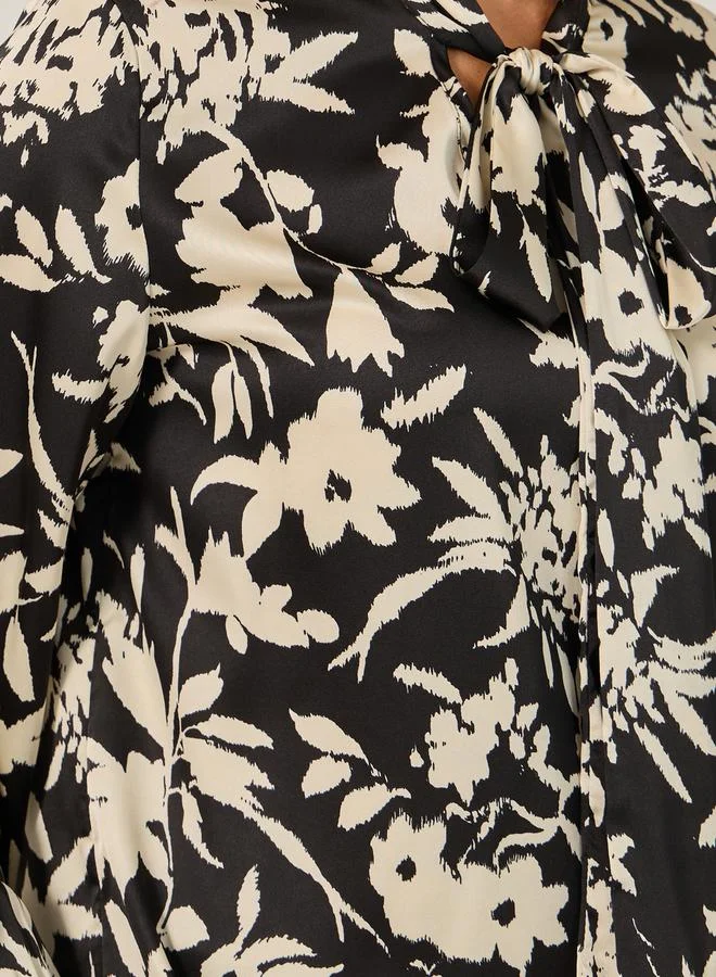 Styli All Over Floral Print Balloon Sleeve Blouse with Tie-Up Neck Detail