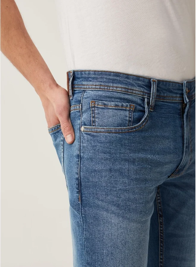 او في اس Faded, slim-fit stretch jeans