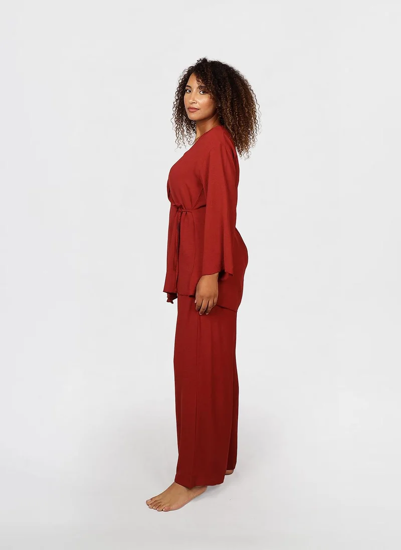 جيمي لي بوند Modest 2 pc Set of wrap-style long-sleeve top with a side tie detail, paired with wide-leg pants