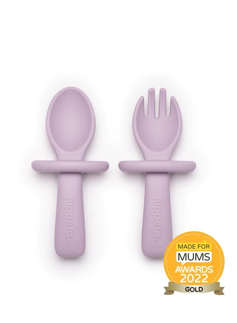 Pippeta The Pippeta My 1st Silicone Baby Spoon & Fork Set is thoughtfully designed to support your baby’s first steps into independent eating. Made from BPA-free, food-grade silicone, it is soft, safe, and gentle on delicate gums. The easy-grip handles are perfect for tiny hands learning to self-feed, while the built-in safety guard adds extra reassurance during mealtimes. Durable and dishwasher safe, it offers everyday convenience for busy parents. A simple, safe, and practical feeding essential that makes the weaning journey smoother and more enjoyable. - Image 1