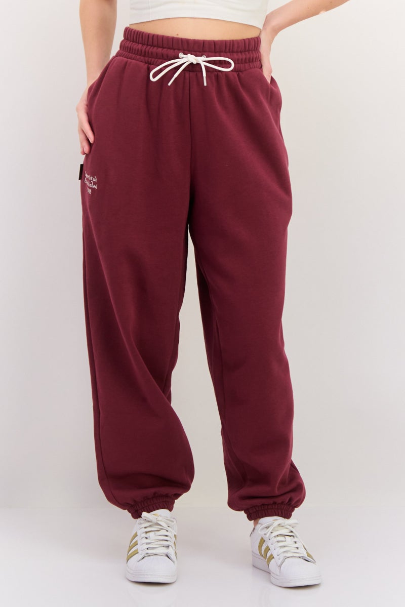 PUMA سروال رياضي خارجي للنساء بقصة مريحة مع حبل سحب، مارون - Image 1