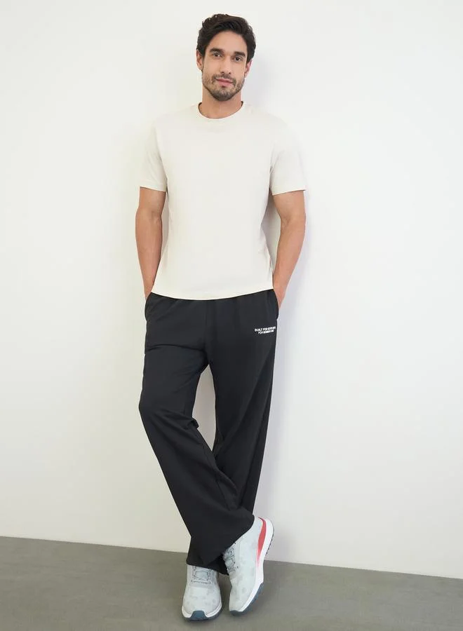 Styli Men Black Slogan Oversized Joggers
