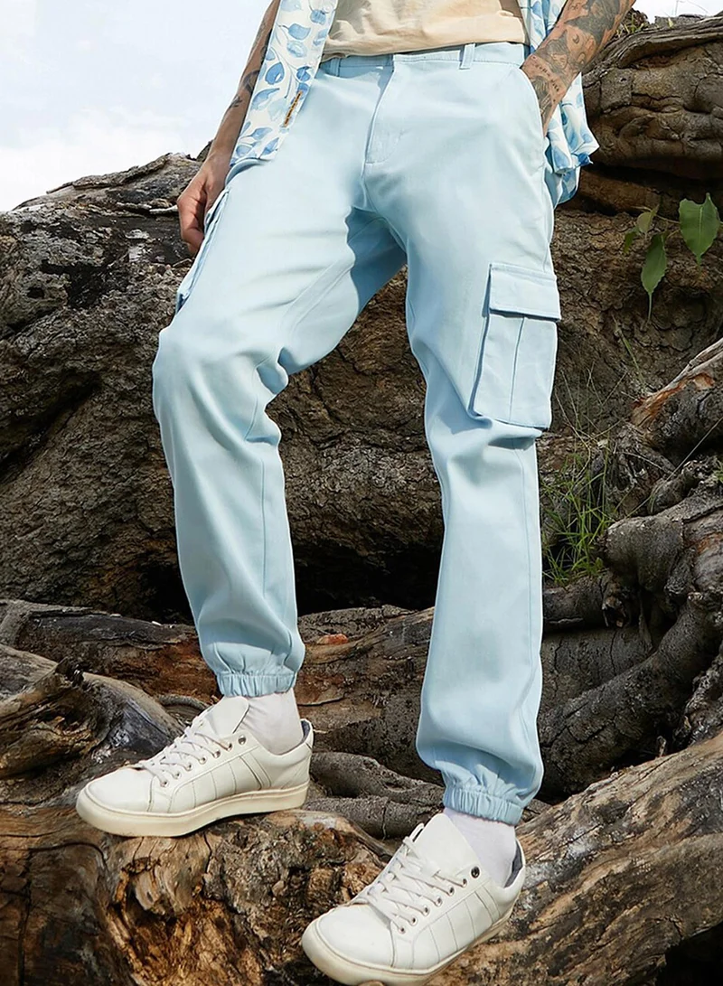Campus Sutra Campus Sutra Men's Light Blue Cuffed Hem Cargo Trousers For Casual Wear | 6 Pockets | Regular Fit | Button Closure | Cotton Poly Cargo Pant Crafted With Comfort Fit For Everyday Wear