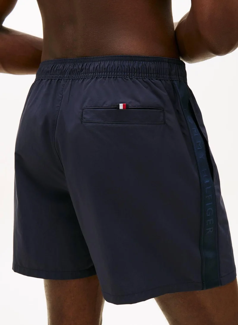TOMMY HILFIGER Desert Sky Tonal Logo Mid Length Swim Shorts for Men | Best Price UAE