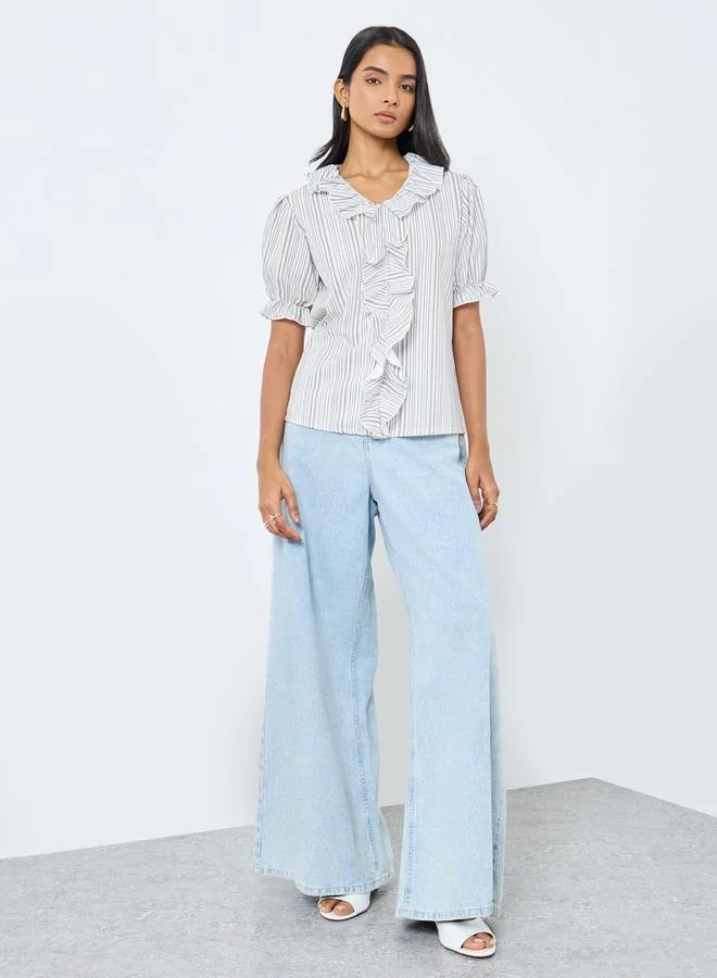 تايك تو بلوزة بأكمام منفوشة مخططة بتفاصيل مكشكشة