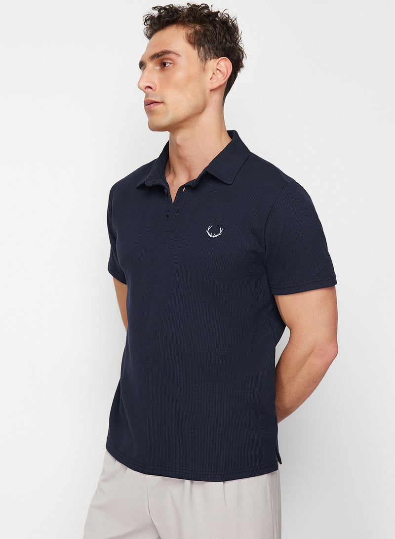 trendyol Navy Blue Textured Embroidered Polo Collar T-Shirt - Regular Cut TMNSS24PO00046 - Image 1