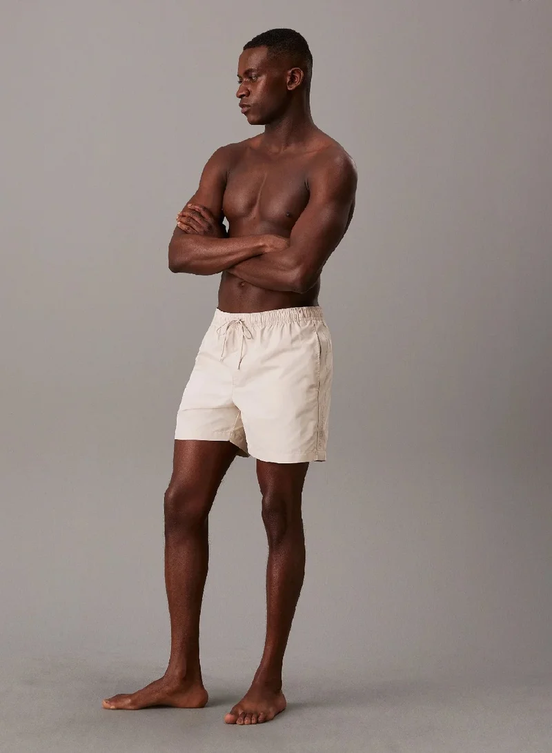 CALVIN KLEIN Stony Beige Medium Drawstring Swim Shorts for Men | Best Price UAE