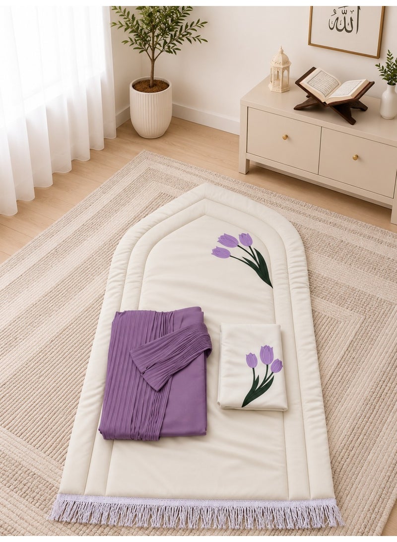 A distinctive Tulip prayer set consisting of a prayer mat with a foam lining in the shape of a mihrab, a plain prayer garment with pleats, and an attached headscarf. One large size for women.
