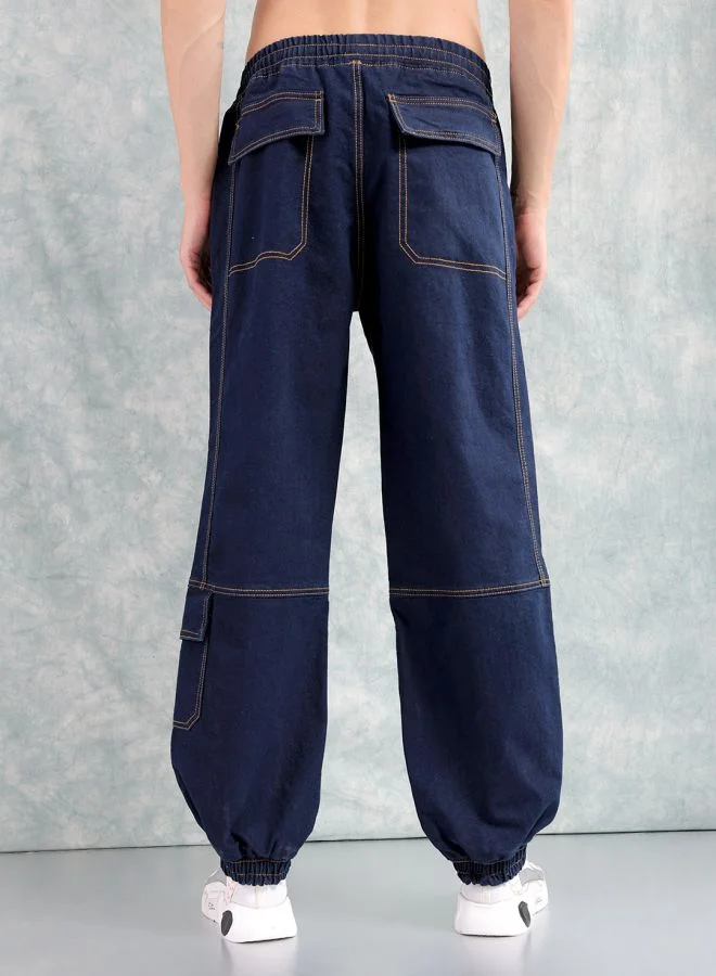 ذا انديان كراج كو Men Loose Fit Solid Mid-Rise Stretchable Denim Joggers
