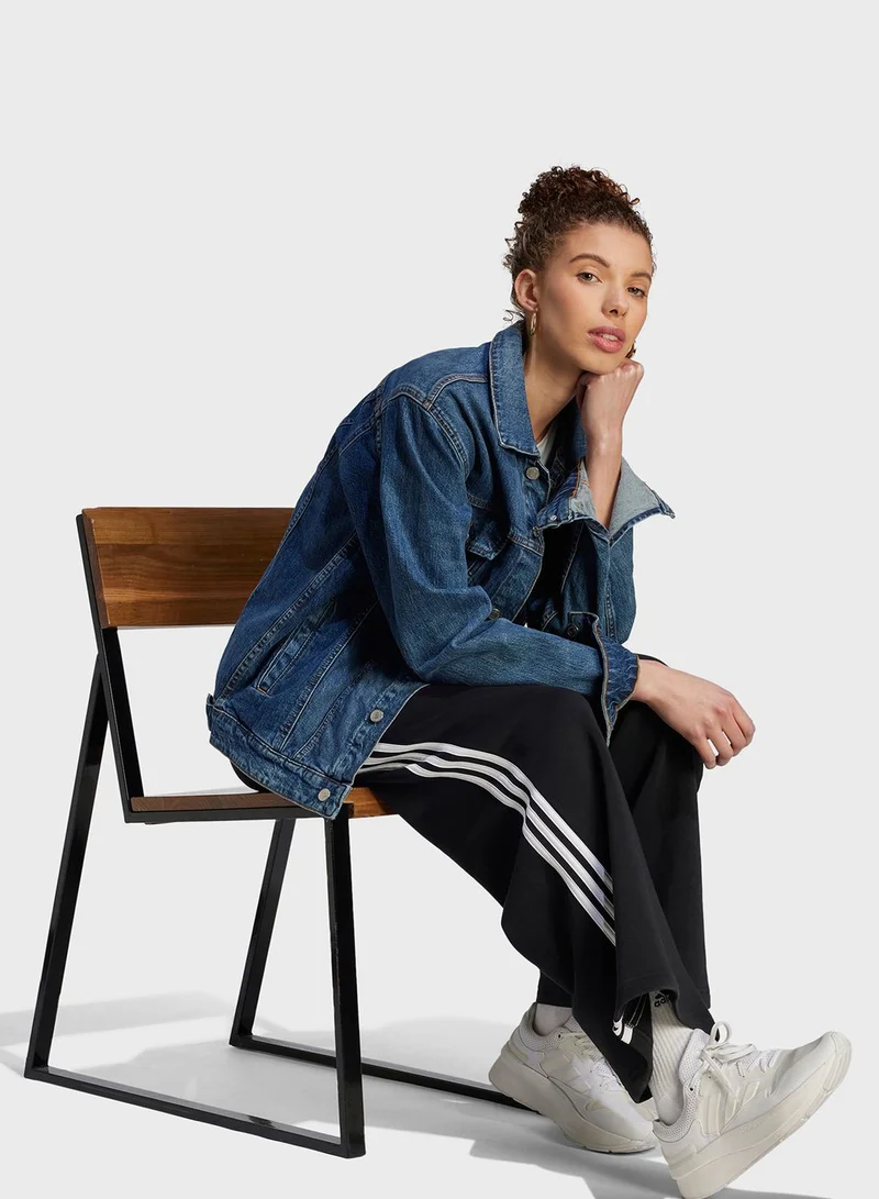adidas بنطال إسينشال واسع من الفيليس مزين بـ 3 خطوط